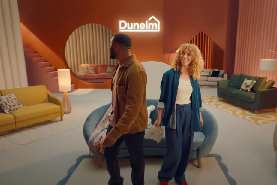 A couple stand in a Dunelm-branded environment, marvelling at the homewares